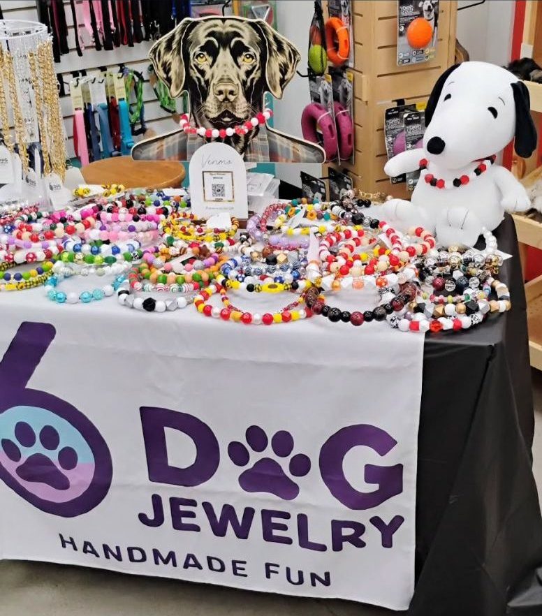 Six Dog Jewelry. Dog jewelry table setup as well as human jewelry. Necklaces and Bracelets.